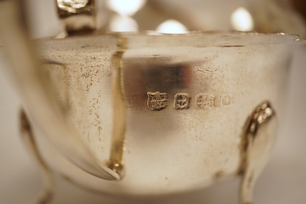 A pair of 1930's silver sauceboats, with cut borders, Barker Brothers Silver Ltd, Birmingham, 1935 and 1938, length 14.6cm, 5.8oz.